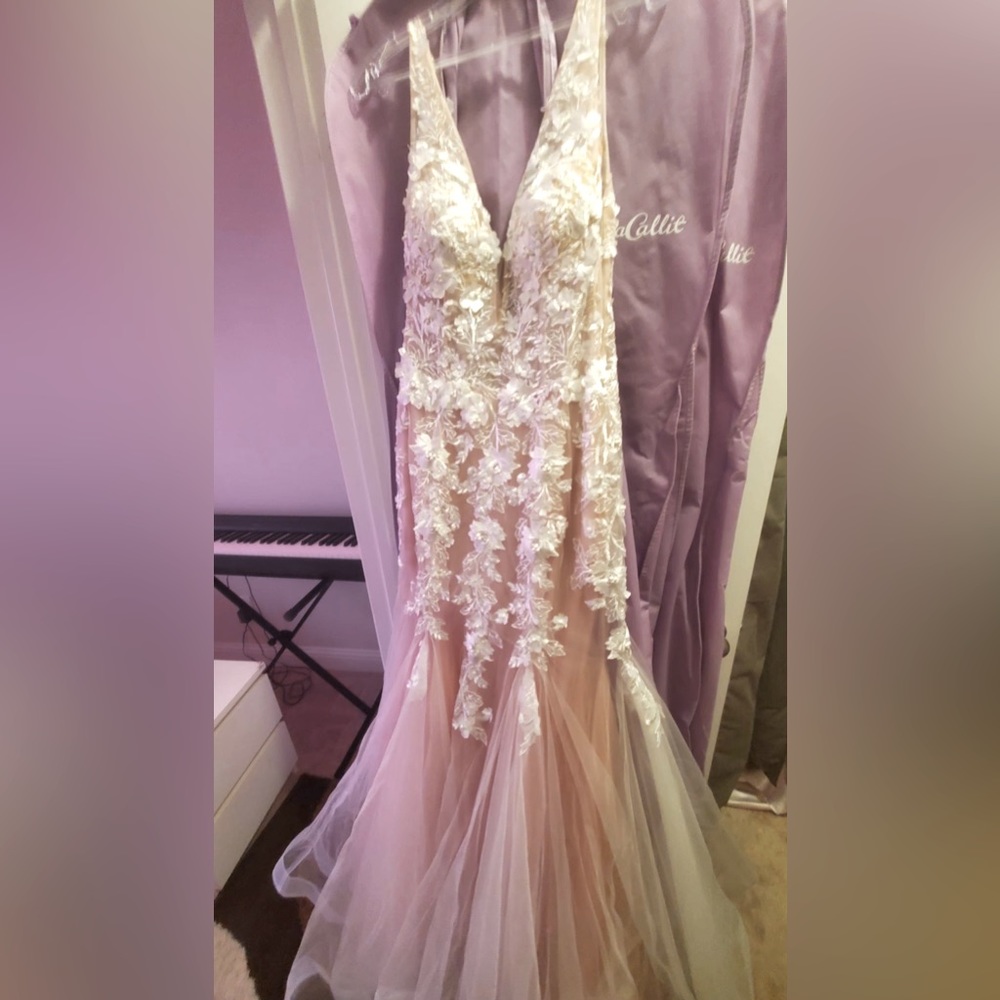 Jovani white/cream wedding dress. Brand new with no tag. But receipt available.